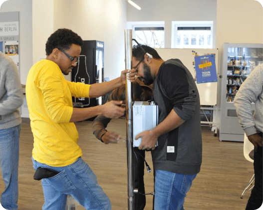 Students learning about a solar inverter